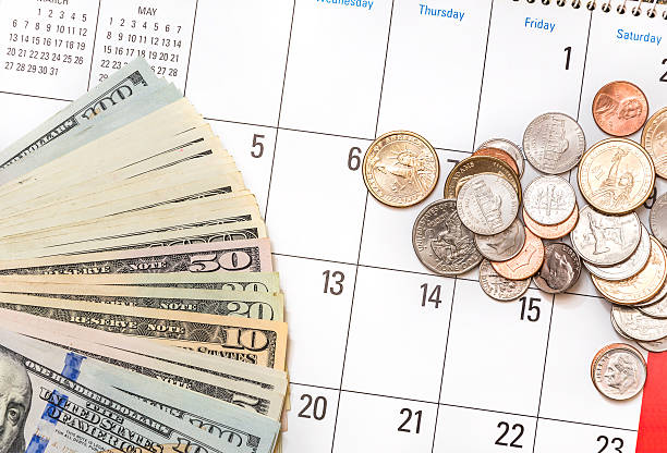 Keeping change by a calendar to keep track of payment plans for affordable bail bonds
