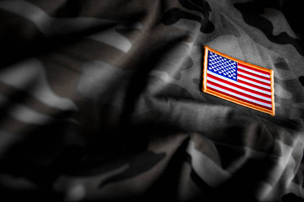 American Flag and Camoflage Image of camoflage and American flag patch memorial day background stock pictures, royalty-free photos & images