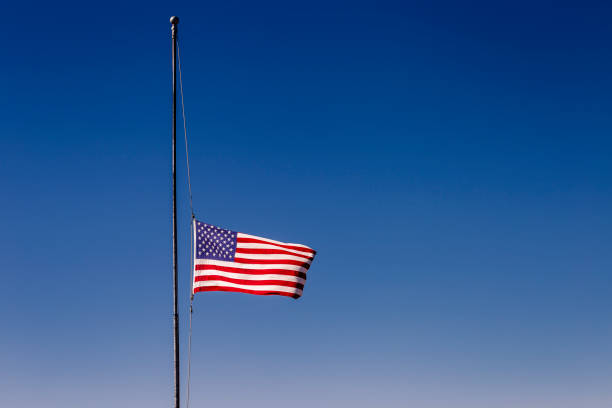 American flag at half mast, 09/11 mouning respect – United States of America American flag at half mast, 09/11 mouning respect – United States of America flag at half staff stock pictures, royalty-free photos & images