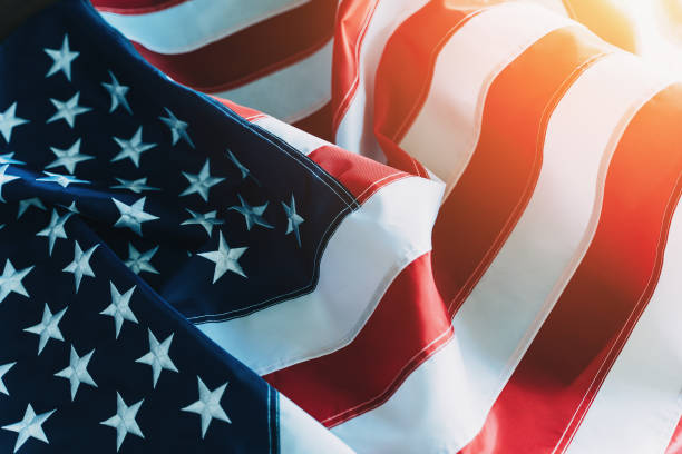 American Flag or United States of America national flag background in sunlight, close up stock photo