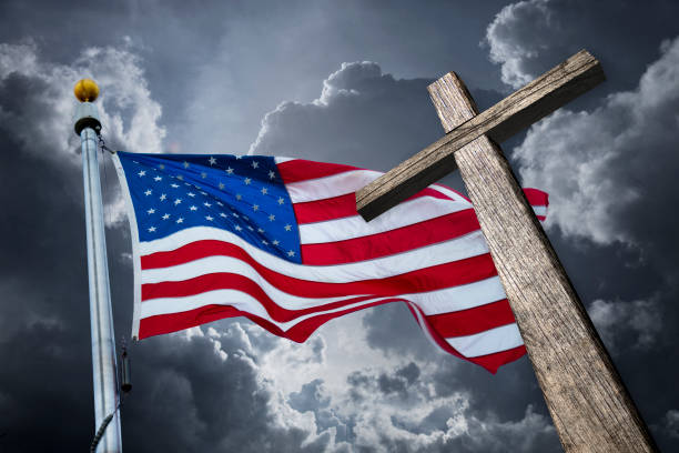 American flag with a christian cross stock photo