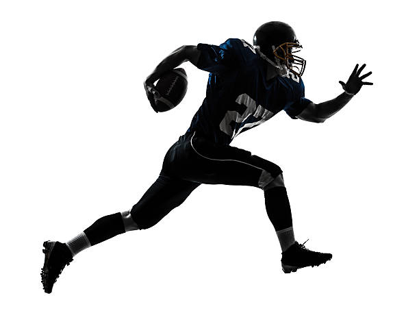 american football player man running silhouette one caucasian american football player man running in silhouette studio on white background american football player stock pictures, royalty-free photos & images