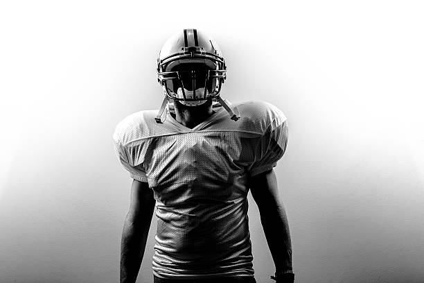 American Football RunningBack Power The power of the american football player before the game. american football player stock pictures, royalty-free photos & images