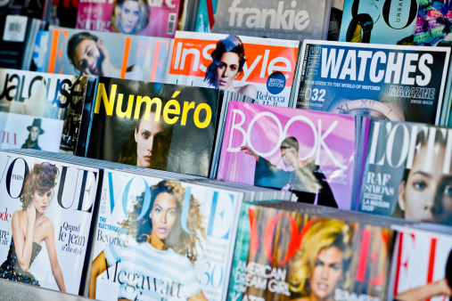 Los Angeles, USA -  May 15, 2013: American Magazines displayed for sale on newsstand in Los Angeles, USA
