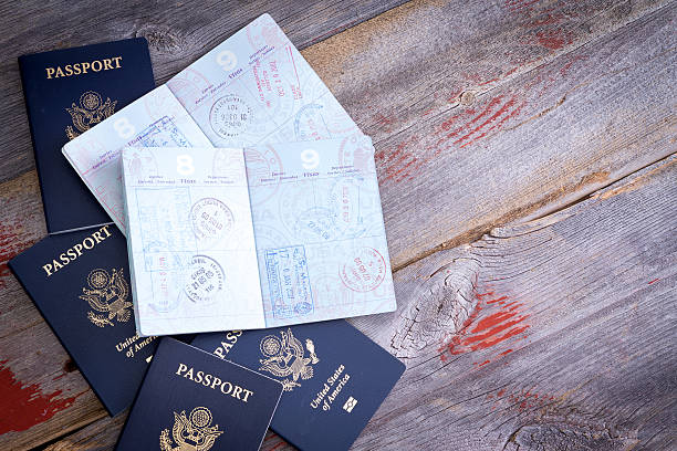 American passports open to reveal stamps stock photo