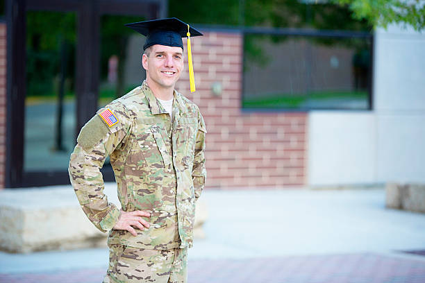 American Soldier with graduation hat stock photo