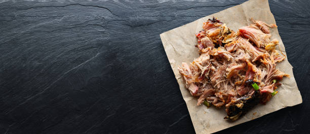 american texas bbq - smoked puilled pork in top down composition stock photo