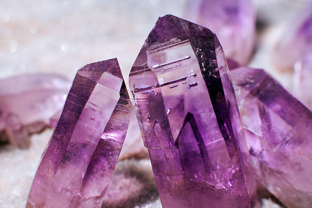 amethyst crystals macro shot of amethyst crystals amethyst stock pictures, royalty-free photos & images
