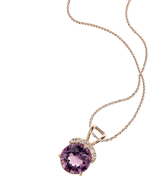 Amethyst & Diamond Necklace Amethyst and diamond necklace on gold chain necklace stock pictures, royalty-free photos & images