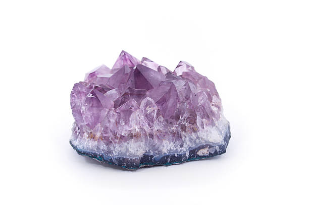 Amethyst Isolated on White "A purple amethyst isolated on white.Amethyst is a bright purple type of quartz, which is often used in jewelry.  Amethyst is no longer very valuable as large deposits have been found in places such as Brazil.  Similar:" amethyst stock pictures, royalty-free photos & images