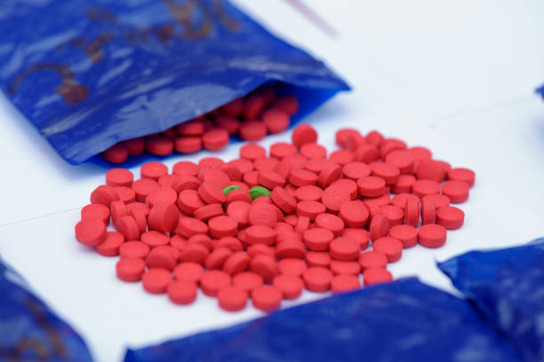Amphetamine pills Amphetamine pills in plastic bags It's illegal. amphetamine stock pictures, royalty-free photos & images