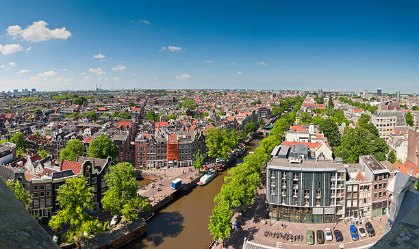 amsterdam, anne frank house blue sky cityscape, holland - anne frank stockfoto's en -beelden