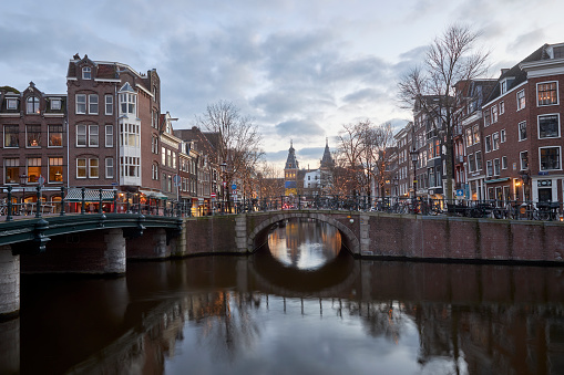 Amsterdam canal cityscape at dusk, The Netherlands
