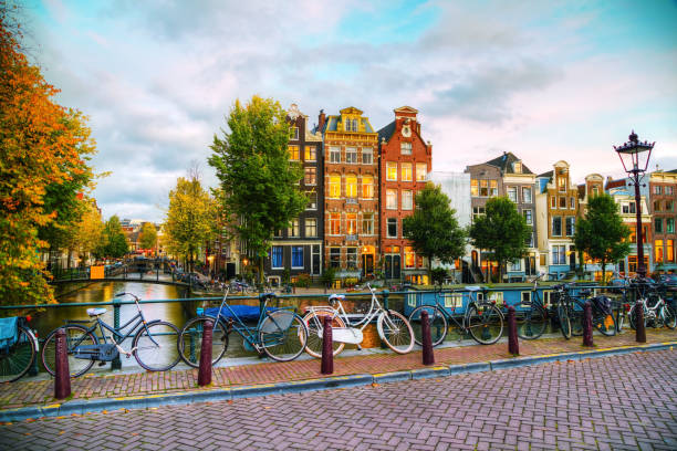 amsterdam city view with canals and bridges - amsterdam street imagens e fotografias de stock
