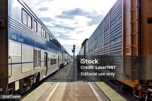 istock Amtrak Pacific Surfliner Passenger Train & Union Pacific Freight Train, Moorpark Station 1334774899