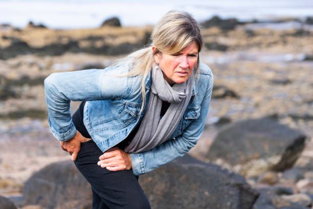 An active mature woman with hip pain stock photo