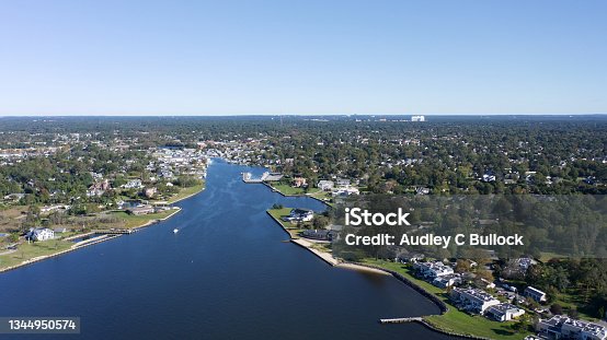 istock An aerial, high angle shot over Bayshore, New York showing the beautiful waters of the Great Cove on a sunny morning. 1344950574