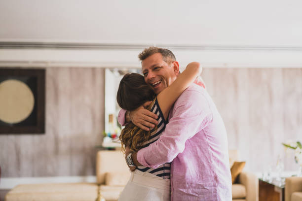An affectionate embrace of Daddy Father, Daughter, Family, Home Interior, People fathers day stock pictures, royalty-free photos & images