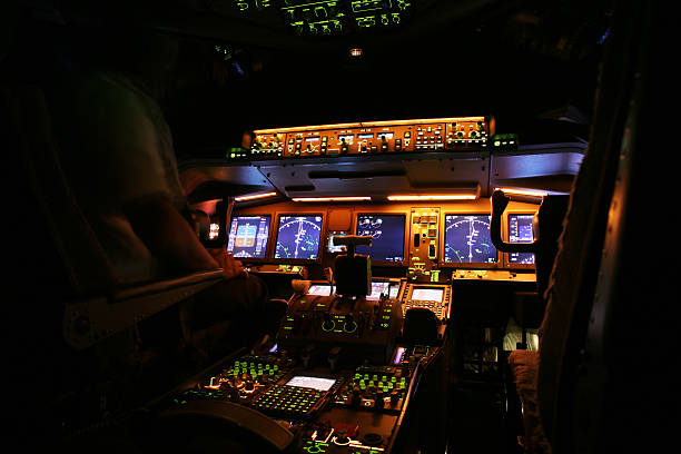 An airplane cockpit at night time stock photo