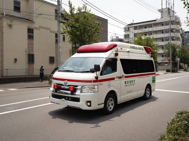 An ambulance that runs with a red light on stock photo