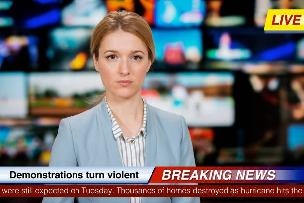 An anchorwoman reporting live breaking news stock photo