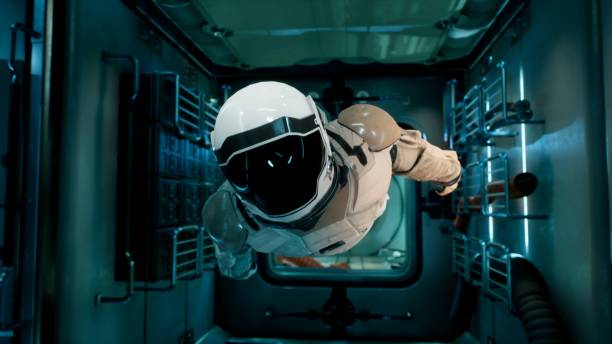An astronaut in zero gravity checks the module of his spaceship. 3D Rendering. stock photo