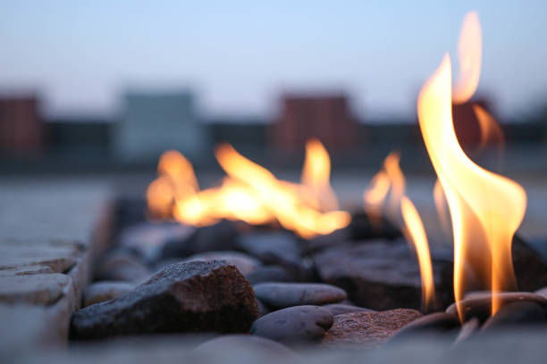 An evening at the Firepit As the blazing sun goes down in Dubai the stone fire illuminates the dark. fire pit stock pictures, royalty-free photos & images