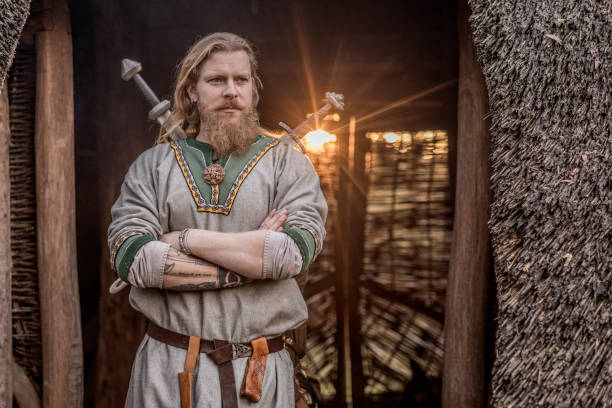 An individual viking man in a viking village settlement An individual viking man posing for an individual pic in an authentic viking settlement village setting historical reenactment stock pictures, royalty-free photos & images