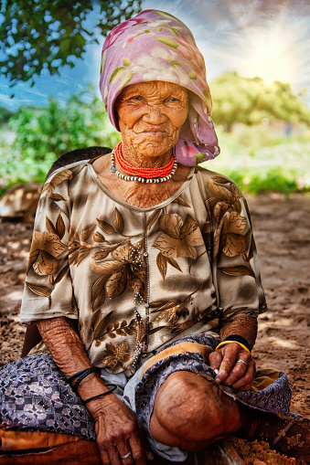 an old bushman woman from Central Kalahari, village New Xade in Botswana