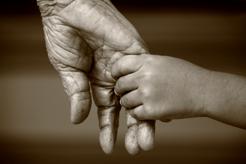 An Old Hand And A Little Young Hand Together Stock Photo ...