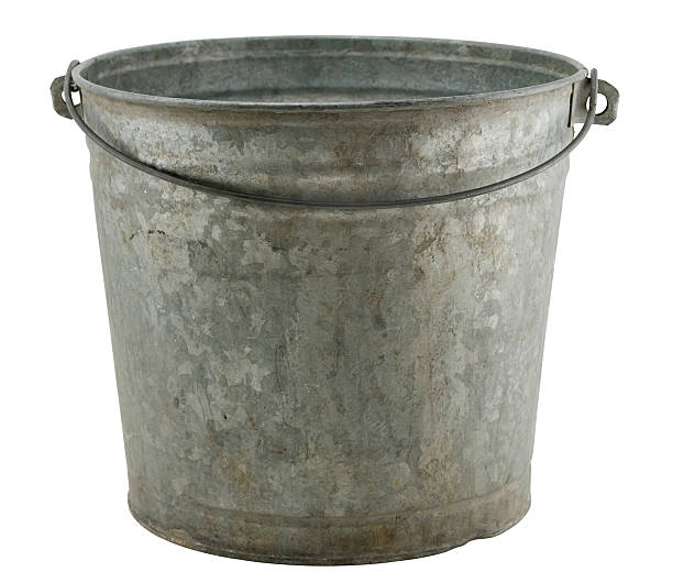 An old rusty farmers milk bucket stock photo