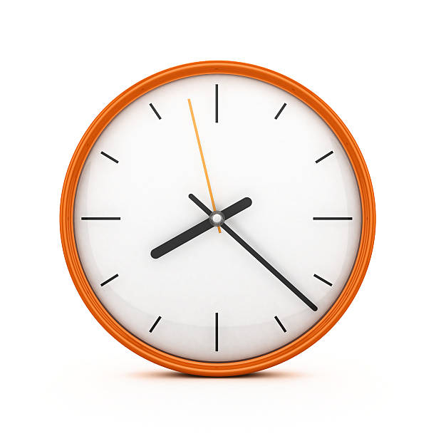 an orange clock on an isolated white background - clock stockfoto's en -beelden