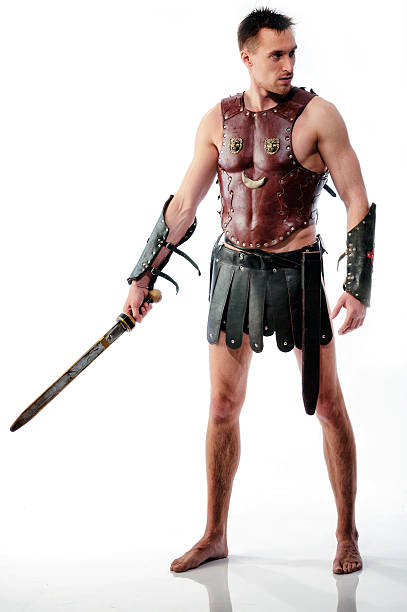 Ancient armed gladiator soldier with sword isolated stock photo
