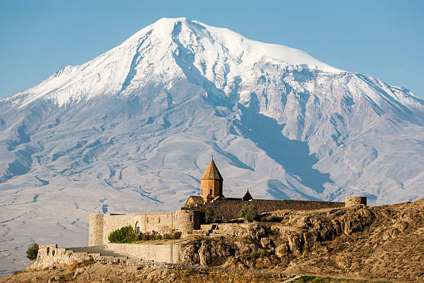 Ancient Armenian church Khor Virap with Ararat on the background Ancient Armenian church Khor Virap with Ararat on the background. The monastery was host to a theological seminary and was the residence of Armenian Catholicos. dormant volcano stock pictures, royalty-free photos & images