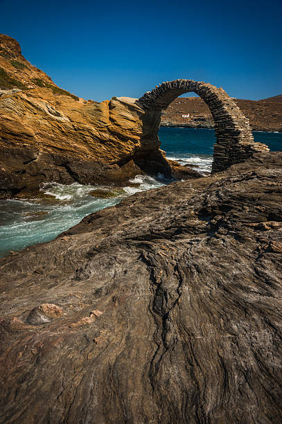 Ancient bridge to small island near the town of Andros, stock photo