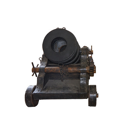 Ancient cannon on wheels isolated on white background with clipping path. Copy space, no shadows