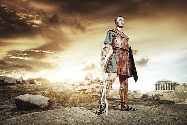Ancient Greek warrior fighting in the combat Ancient Greek rome warriors fighting with swords and shields in the combat on sand and dust. Achilles and Hector fighting at Troy laconia greece stock pictures, royalty-free photos & images