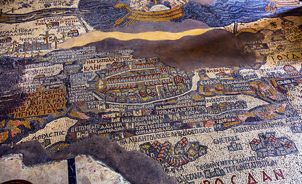 Ancient Jerusalem Mosaic Saint George Church Madaba Jordan Madaba, Jordan - November 25, 2016: Ancient 6th Century Map Jerusalem Mosaic Saint George Greek Orthodox Church Madaba Jordan.  Mosaic discovered 1884 and depicts the Holy Land, including Jerusalem, Jordan River and Dead Sea in  6th Century AD.  Map was used to discover Christ's actual baptism site in Bethany Jordan. jordan middle east stock pictures, royalty-free photos & images