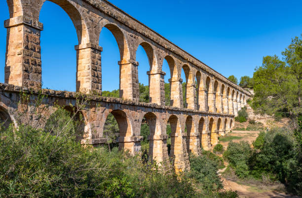 Ancient roman aqueduct Ponte del Diable or Devil's Bridge in Tarragona, Spain. stock photo