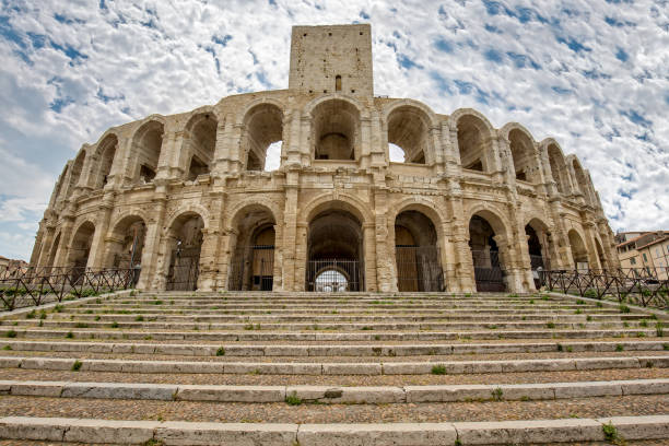 Ancient Roman arena in Arles-Arenes d' Arles A view of the Roman Amphitheater of Arles, Provence, Bouches-du-Rhône, France romanesque stock pictures, royalty-free photos & images