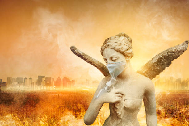 angel statue using washing hand with alcohol sanitizer and dust mask on city and arid meadow background. to protect themselves from virus infection in  corona virus crisis. - covid cemiterio imagens e fotografias de stock
