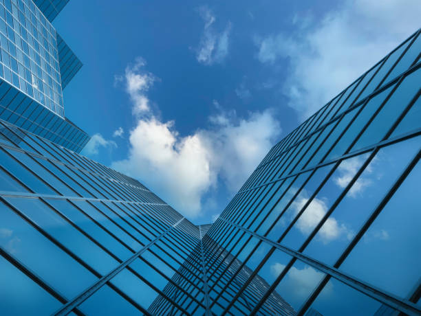 Angle view of modern building with cloud reflections stock photo