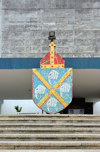 Monrovia, Liberia: Cathedral Church of the Holy Trinity, seat of the Anglican Bishop of Liberia - Episcopal Church of Liberia - coat of arms of the Episcopal Diocese of Liberia (Anglican Province of West Africa), yellow saltire (St Andrew's Cross) on a blue field and four elephant heads, Broad Street, Snapper Hill