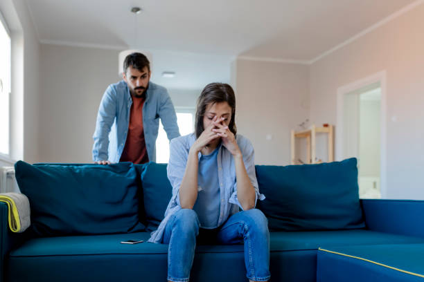 Angry Couple Having an Argument Angry Fury Man Screaming at Woman. Angry Couple Having an Argument in Their Living Room. Young Marriage Couple Have an Argument Because of Relationship Crisis. Couple Having Argument - Conflict, Bad Relationships. fighting stock pictures, royalty-free photos & images