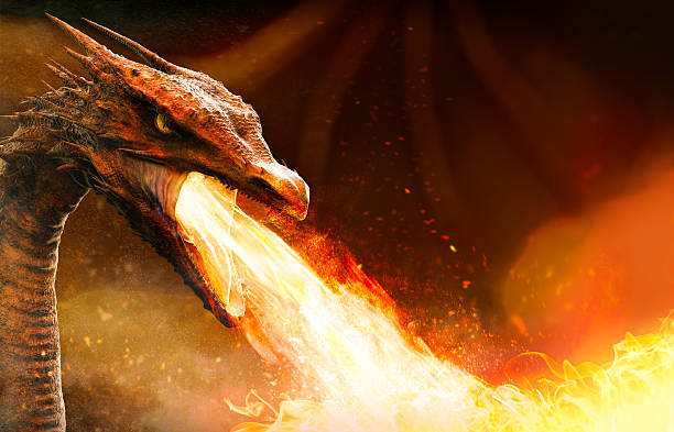 angry dragon spitting fire stock photo