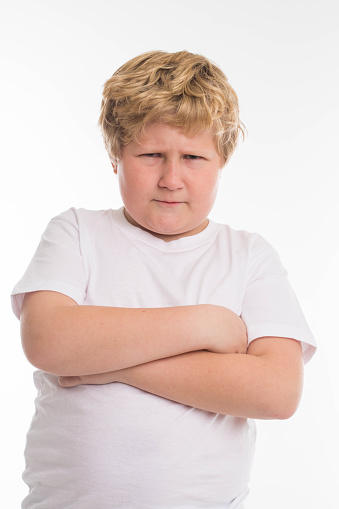 angry-fat-boy-blond-isolated-on-white-picture-id506915590