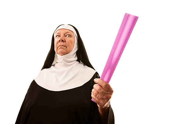 Angry Nun with Ruler stock photo