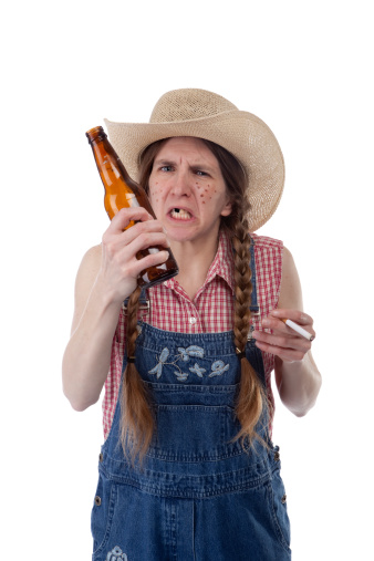 An angry redneck woman shaking a beer bottle. 