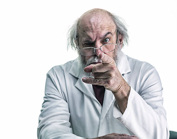 Angry Scientist With Wild Hair Pointing Finger At Camera stock photo
