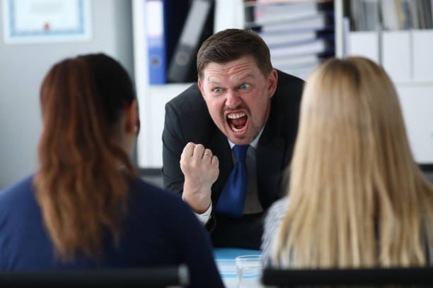 Angry shouting manager Portrait of screaming businessman angrily looking at guilty business worker made important mistake. Serious male standing in big modern corporate cabinet. Blurred background angry general manager stock pictures, royalty-free photos & images